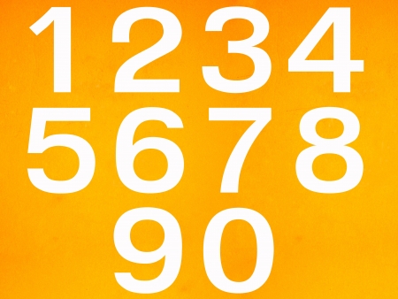 close up on white stenciled number on yellow wallの写真素材