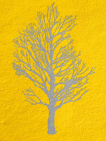 Tree on  yellow cement wallの写真素材