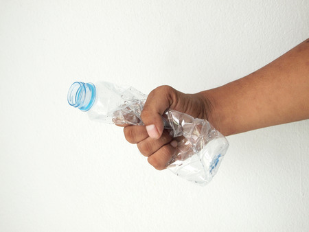 Hand squash a plastic bottle
