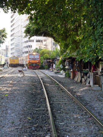 BANGKOK, THAILAND - MARCH 3: Train rides on railway in Bangkok, Thailand on March 3, 2012. のeditorial素材