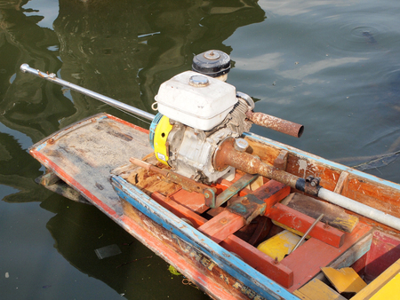 Engine with rear side of long tail boat