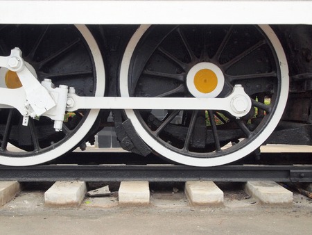 Old locomotive wheels close up.の写真素材