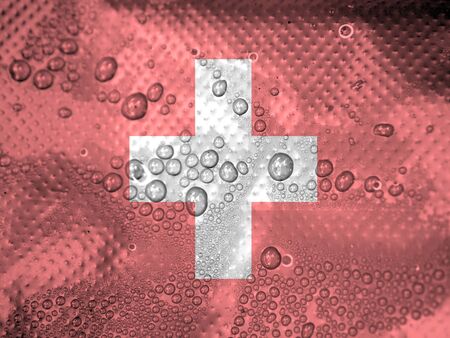 water drops on switzerland flag backgroundの写真素材