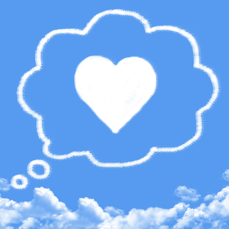 Cloud shaped as thinking of falling in loveの写真素材