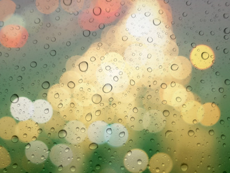 close up drops of rain on glass background. bokeh out of focus