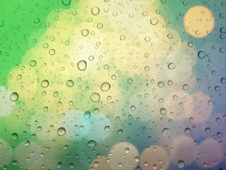 close up drops of rain on glass background. bokeh out of focus