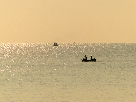seascape in sunny day and people on boatの写真素材