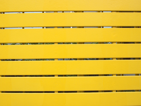 horizontal planks with bright yellow paintの写真素材