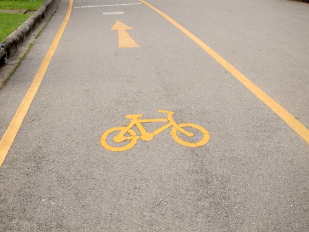 Bicycle road sign painted on the pavementの写真素材