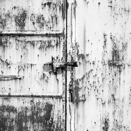black and white Old metal door with rust in Asiaの写真素材