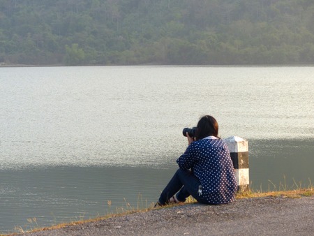 Asian women shooting camera