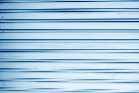 blue panel steel wall backgroundの写真素材