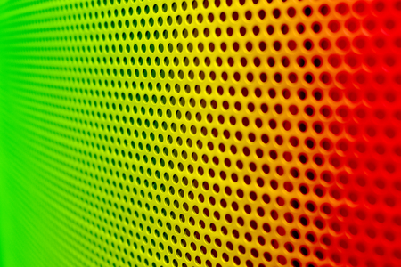 reggae color steel surface with little round holesの写真素材