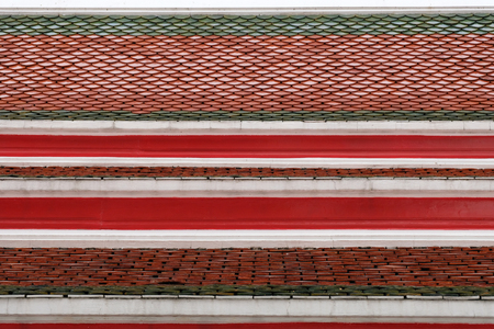 texture of tile red roof background in Thai temple