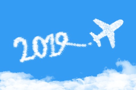 Airplane shape clouds 2019 route. Happy new year conceptの写真素材