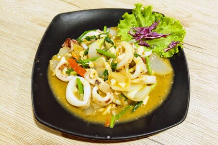 Fried squid with curry powderの写真素材