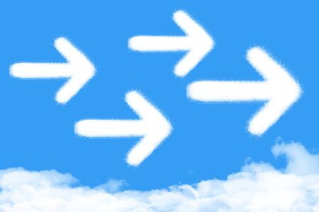 Arrow shaped cloud on blue skyの写真素材