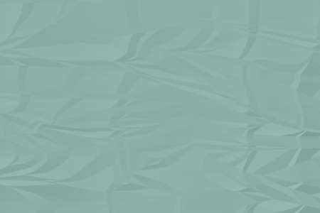 crumpled green paper background close upの写真素材