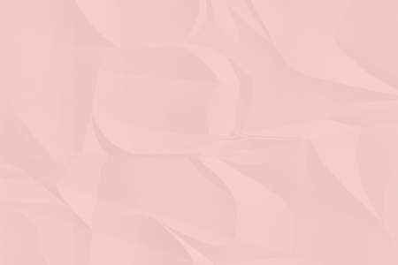 crumpled pink paper background close upの写真素材