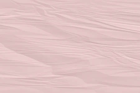 crumpled pink paper background close upの写真素材