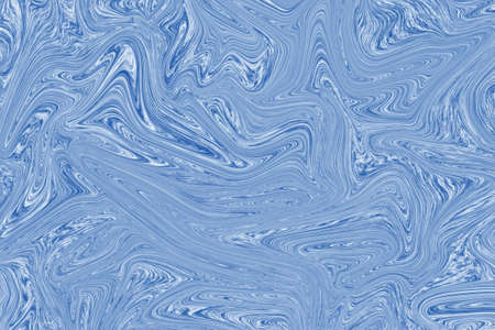 Liquid blue paint on white paper abstract backgroundの写真素材