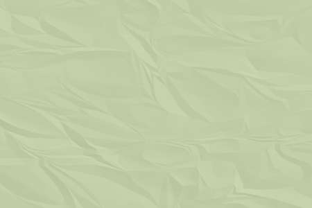 crumpled green paper background close upの写真素材