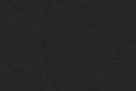 crumpled black paper background close upの写真素材