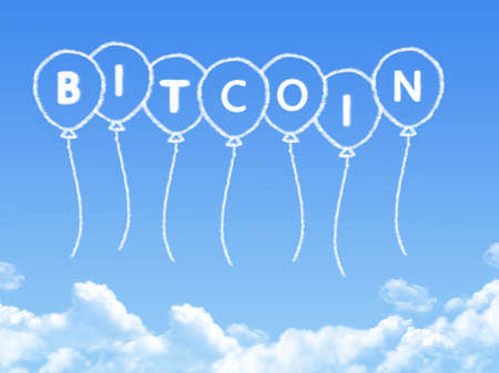 bitcoin balloon cloud shape on blue skyの写真素材