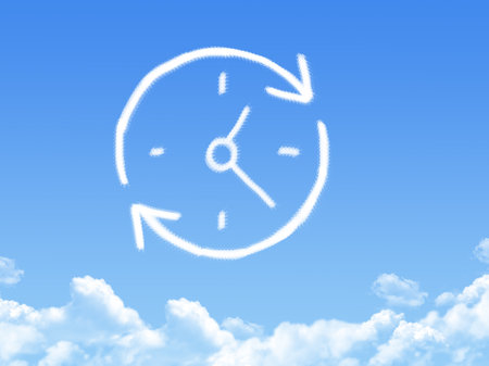 time arrow cloud shape on blue skyの写真素材