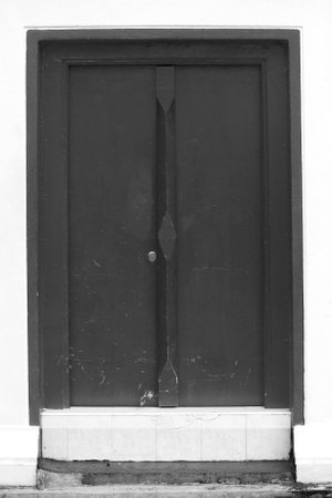 Exterior of old wooden door black and whiteの写真素材