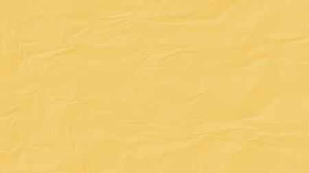 crumpled yellow paper background close upの写真素材