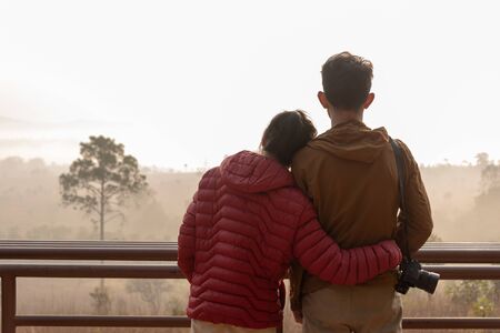 A couple Admire nature while sunriseの写真素材
