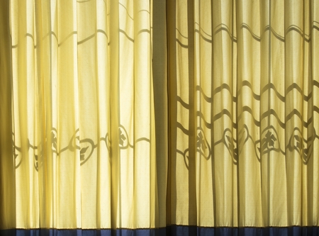 Shadow over curtainの写真素材