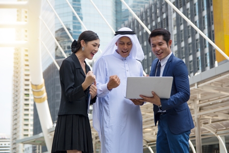 Businessmen celebrating achievement togetherの写真素材