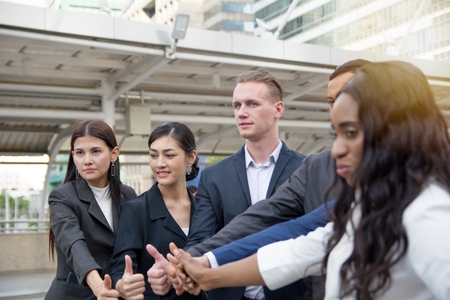 Businessmen thumb up to celebrate achievementの写真素材