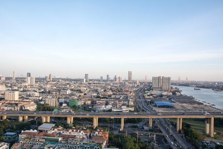 Bangkok Cityscape beside river during twilight time