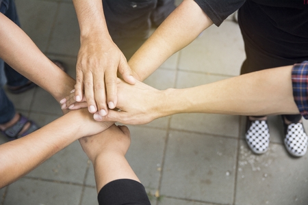 Hands together for unity and share successの写真素材