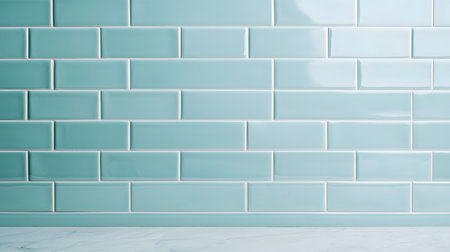 A close-up view of immaculate bathroom tiles exuding a bright, glossy turquoise finish against a light backdrop.の素材