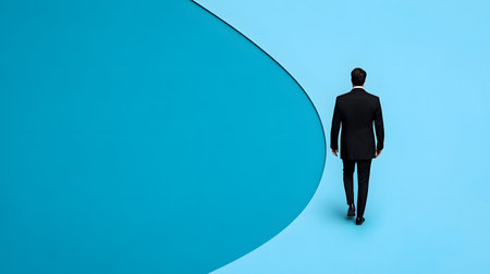A man in a black suit walks against a smooth, light blue backdrop, evoking thoughts of introspection. The atmosphere is serene, emphasizing solitude and contemplation amid vivid colors.の素材