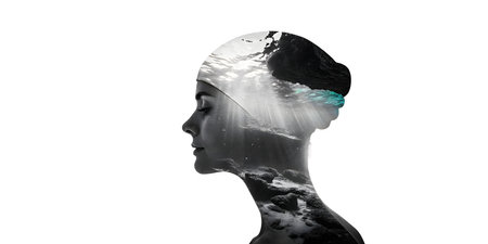 A womans profile is artfully overlaid with an underwater scene. The image showcases a serene expression, eyes closed. The background is a solid white, providing contrast. The double exposure technique creates a mysterious and peaceful atmosphere. The overall effect is both artistic and thought-provoking.の素材