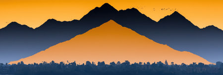 A stunning mountain range is beautifully silhouetted against a vibrant sunset sky, featuring a blend of warm colors and birds in flight, creating a tranquil atmosphere.の素材