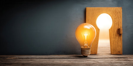 A glowing light bulb rests beside a keyhole doorway, representing the connection between ideas and new opportunities in life. Inspiring and thought-provoking.の素材