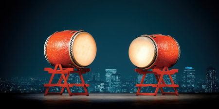 Two traditional Japanese taiko drums set on stands against a vibrant city skyline at night, highlighting the beauty and cultural significance of this art form.の素材