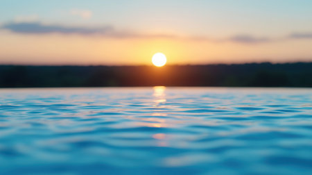 This captivating image showcases a serene sunset reflected on a calm water surface, perfect for evoking feelings of tranquility and relaxation in any setting.の素材
