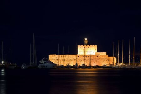 Night shot of Fortress of St Nicholas in the harbor of Rhodes, Greeceの写真素材