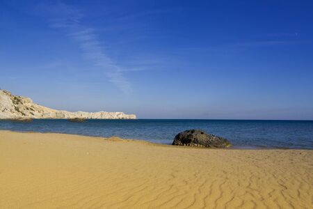 Beach with the structure of windblown gold sandの写真素材