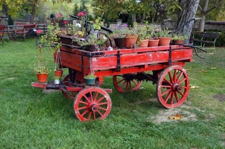 Old horse drawn wagon filled with flowers         