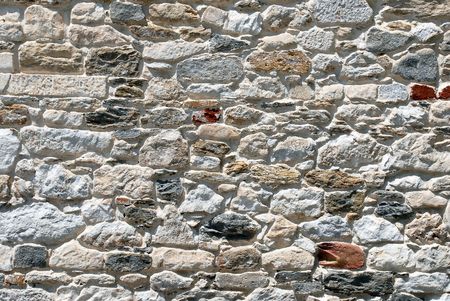 Close up image of old mixed stone wall