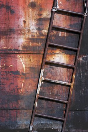 Old rusty metal ladder, vertical image, diagonal composition                                の写真素材