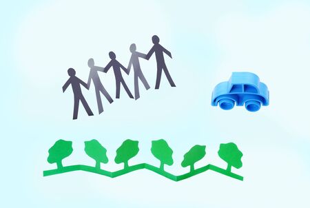 Paper people celebrating eco environment, conceptual photoの写真素材